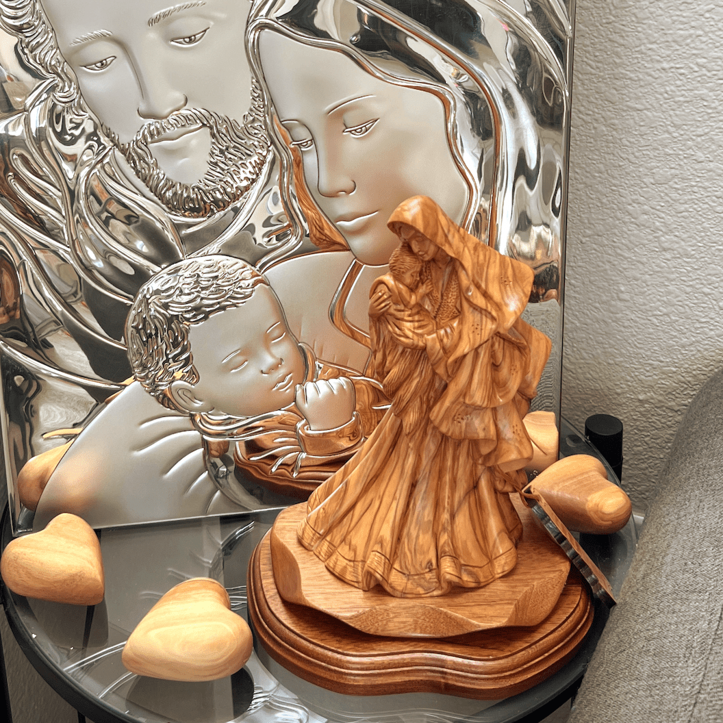 Virgin Mary in Unique Gown, Holding Baby Jesus Christ our Lord, Mahogany Base, Standing in front of Holy Family Silver Icon, with carved hand made gift hearts