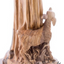Young Deer standing next to Saint Francis of Assisi Sculpture, with wood grains
