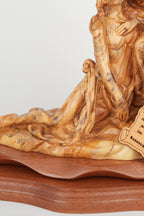 Pieta statue hand carved from Bethlehem olive wood, back view of the olive wood sculpture