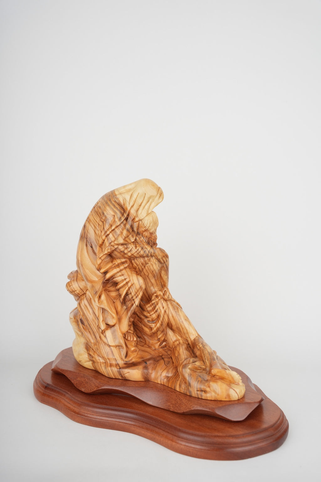 Pieta statue hand carved from Bethlehem olive wood, close detail of the hand carved work