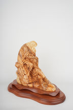 Pieta statue hand carved from Bethlehem olive wood, close detail of the hand carved work