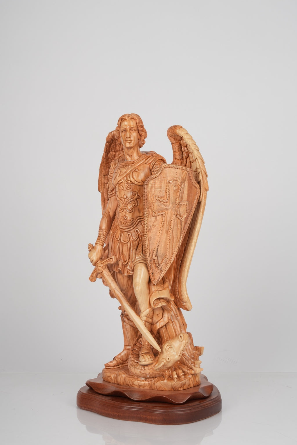 Angel olive wood statue hand carved in Bethlehem, side angle of the olive wood sculpture
