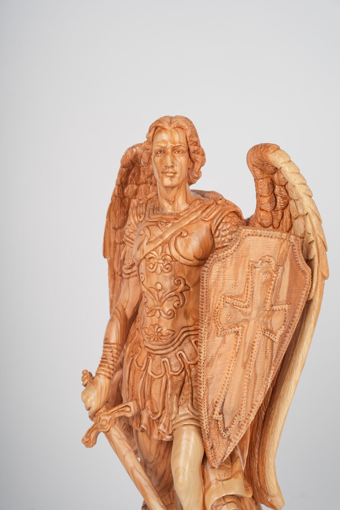 Angel olive wood statue hand carved in Bethlehem, three quarter view of the religious piece