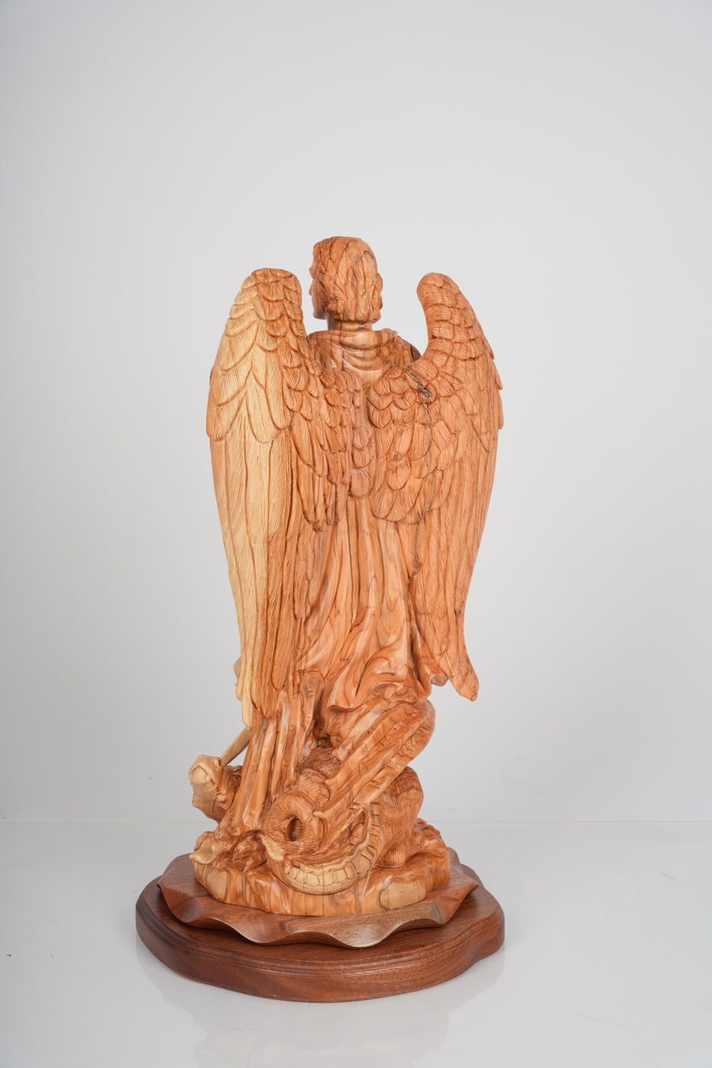 Angel olive wood statue hand carved in Bethlehem, close detail of the hand carved work