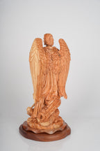 Angel olive wood statue hand carved in Bethlehem, close detail of the hand carved work