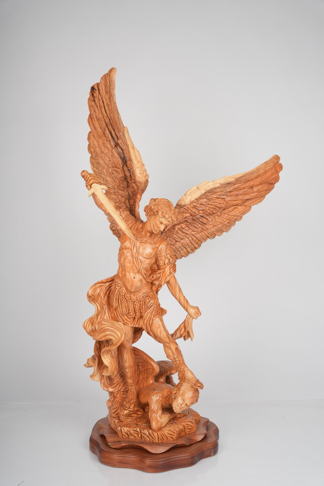 Angel olive wood statue hand carved in Bethlehem, front view of the olive wood masterpiece