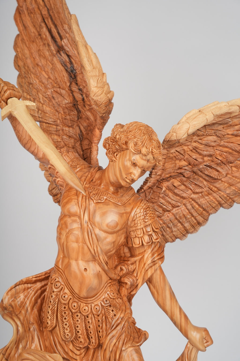 Angel olive wood statue hand carved in Bethlehem, close detail of the hand carved work