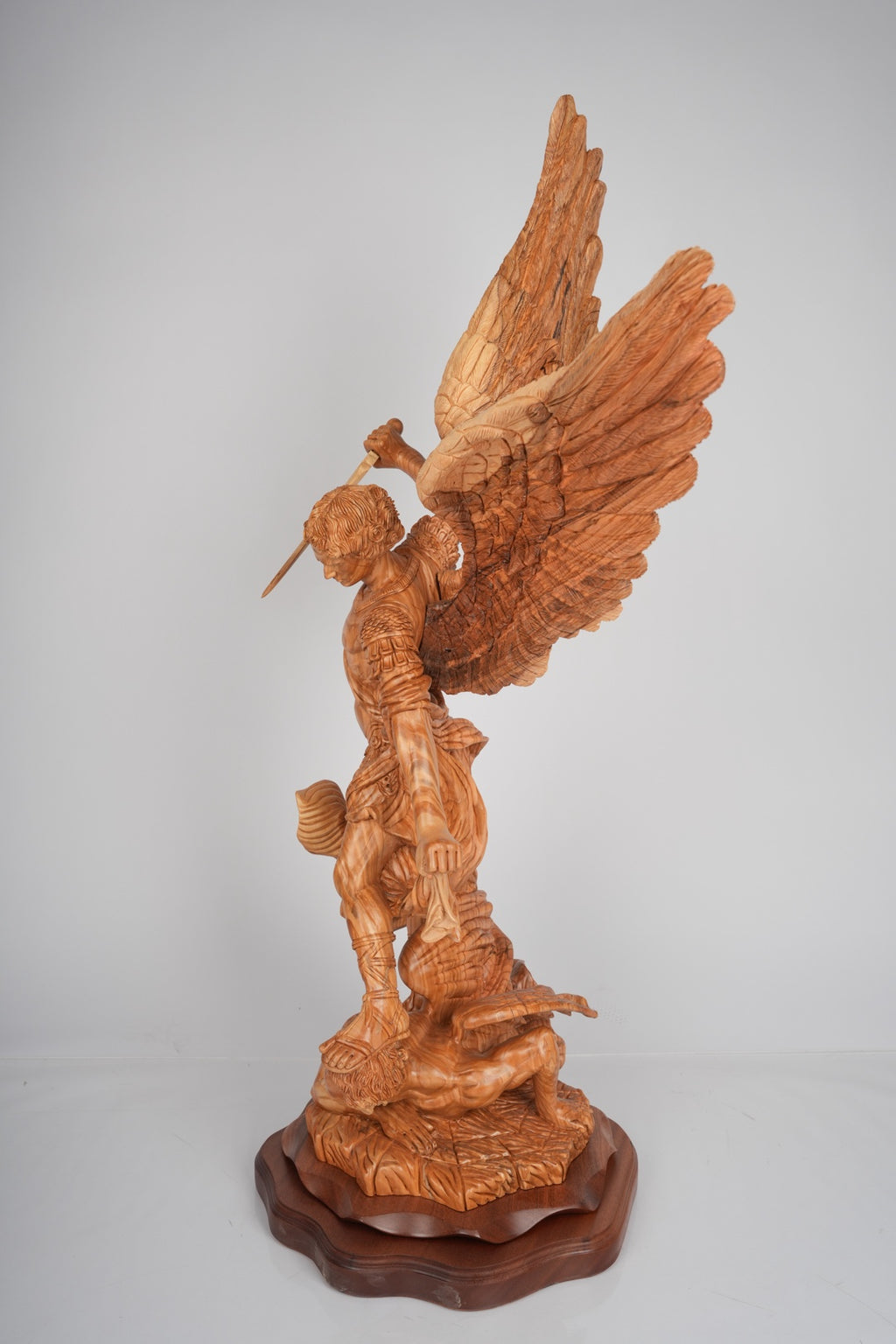 Angel olive wood statue hand carved in Bethlehem, lifestyle photo on display