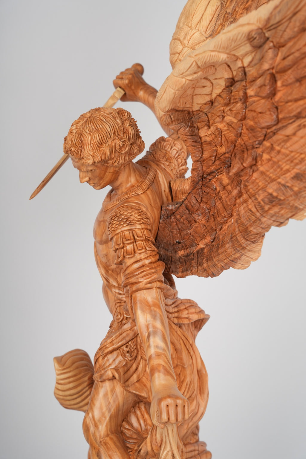 Angel olive wood statue hand carved in Bethlehem, natural light photo of the piece