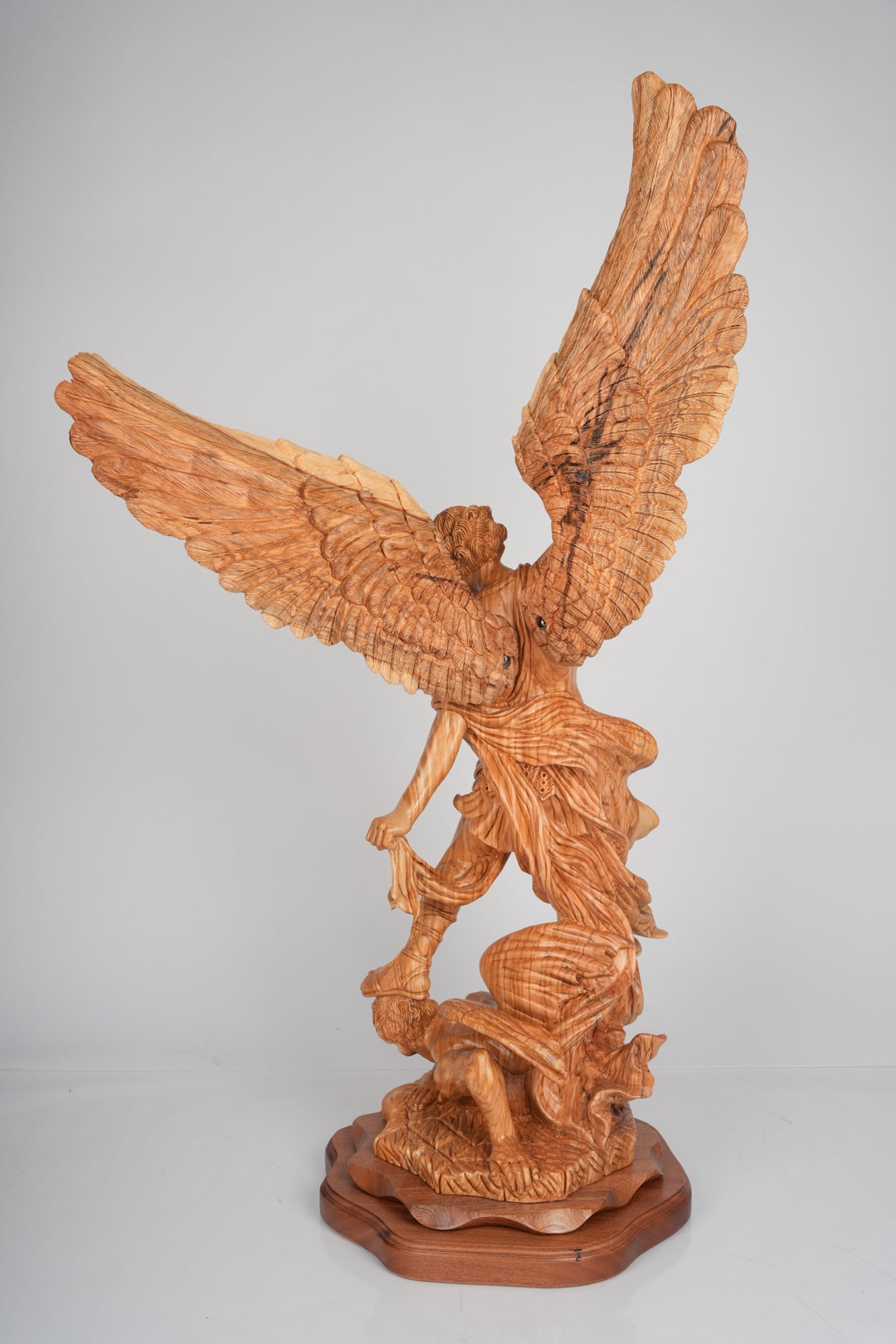 Angel olive wood statue hand carved in Bethlehem, close up showing the olive wood grain