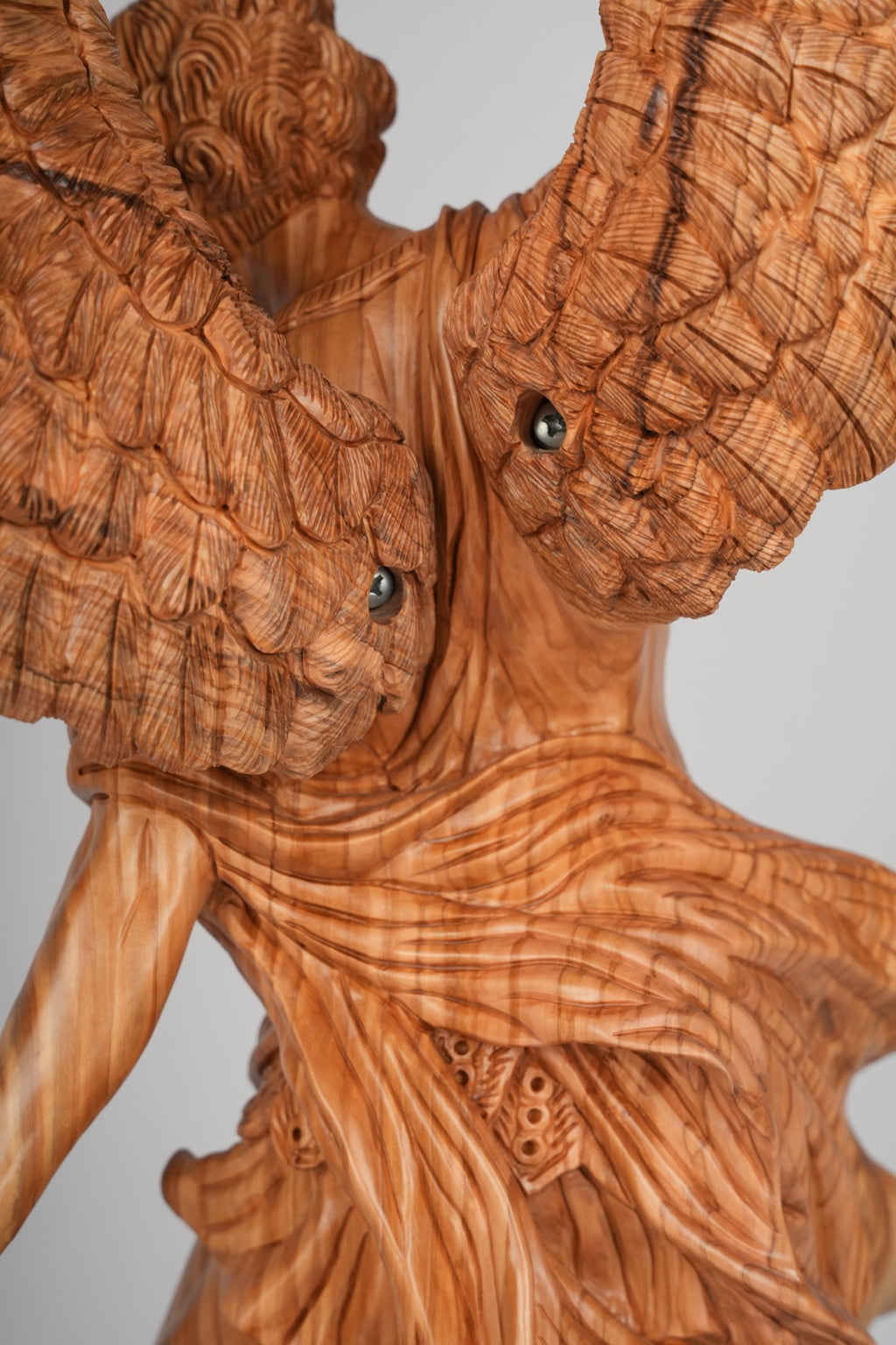 Angel olive wood statue hand carved in Bethlehem, opposite side angle of the religious sculpture