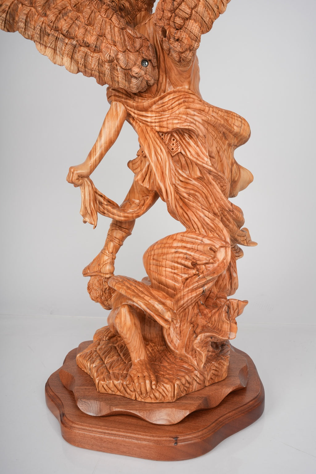 Angel olive wood statue hand carved in Bethlehem, detail of the carved base