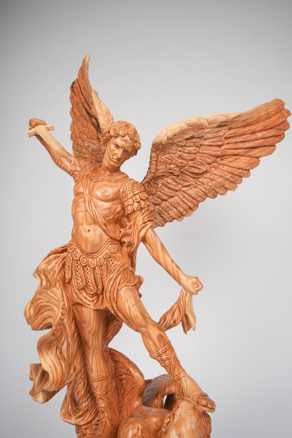 Angel olive wood statue hand carved in Bethlehem, side angle of the olive wood sculpture