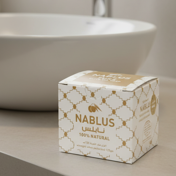 Nablus pure olive oil soap packaging with gold text and patterns on a white background