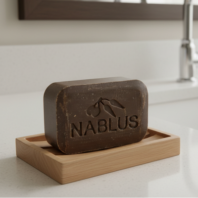 Bar of Nablus soap with branding on a white background