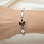 Mother of Pearl Bracelet 8 x 6mm Beads (Orange Crystal Stone)