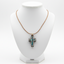 White, Blue-Green Mother of Pearl Cross Necklace on Olive Wood Base