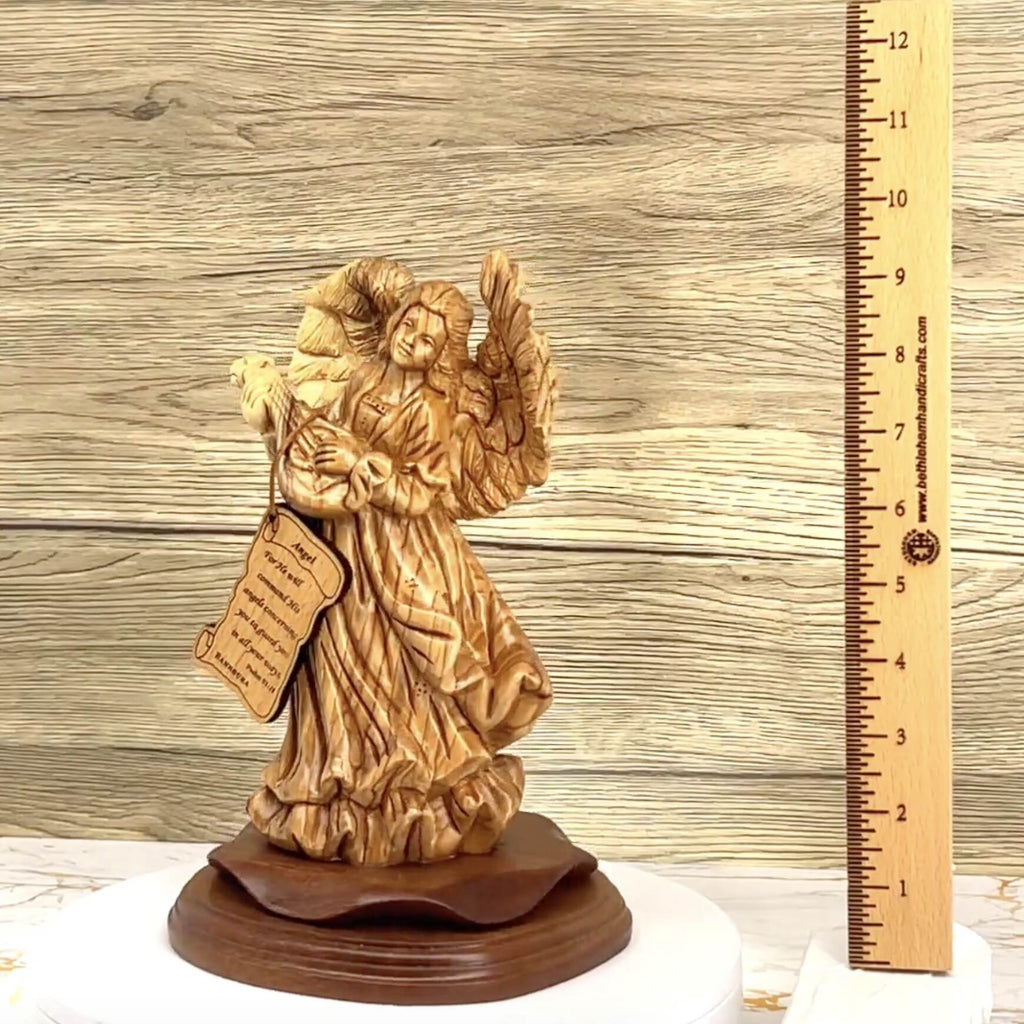 Angel olive wood statue hand carved in Bethlehem, 9.7 inch three quarter view of the religious piece