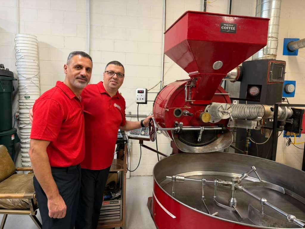 Checking the dark roast at the drum roaster