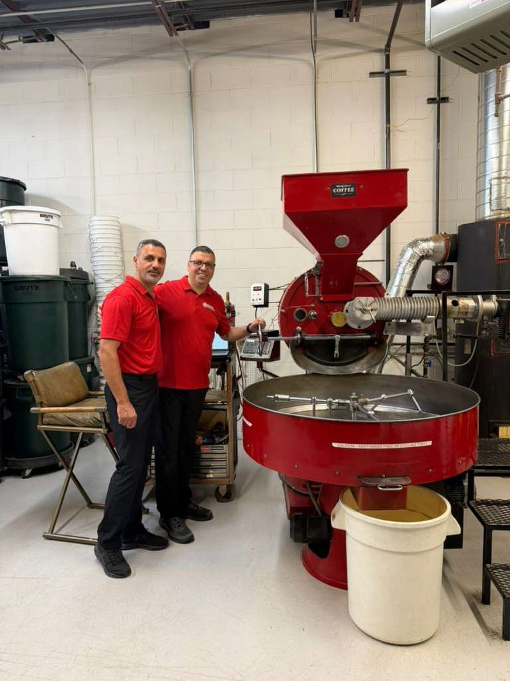 The Bannoura family beside the drum roaster in Colorado