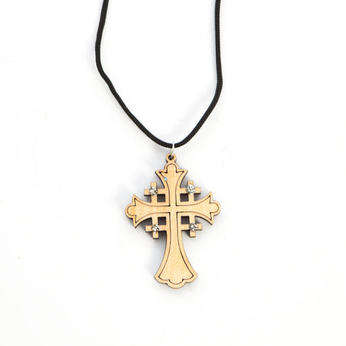 Religious jewelry hand made in Bethlehem Holy Land, side angle of the olive wood sculpture