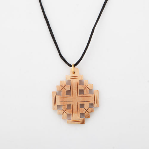 Religious jewelry hand made in Bethlehem Holy Land, side angle of the olive wood sculpture