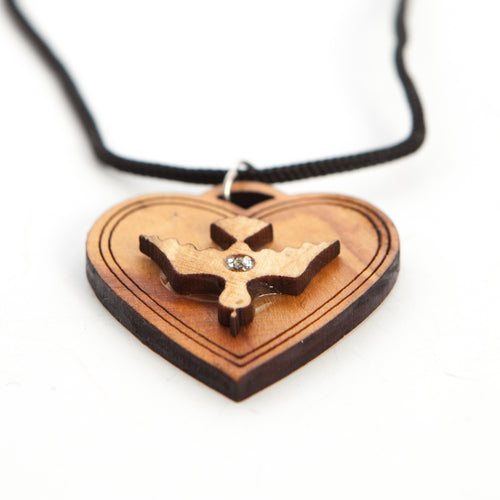 Religious jewelry hand made in Bethlehem Holy Land, side angle of the olive wood sculpture
