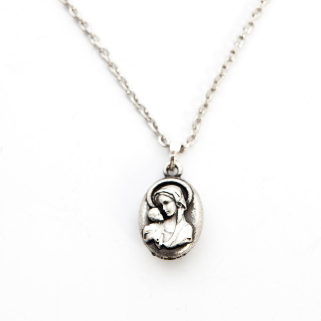 Religious jewelry hand made in Bethlehem Holy Land, side angle of the olive wood sculpture