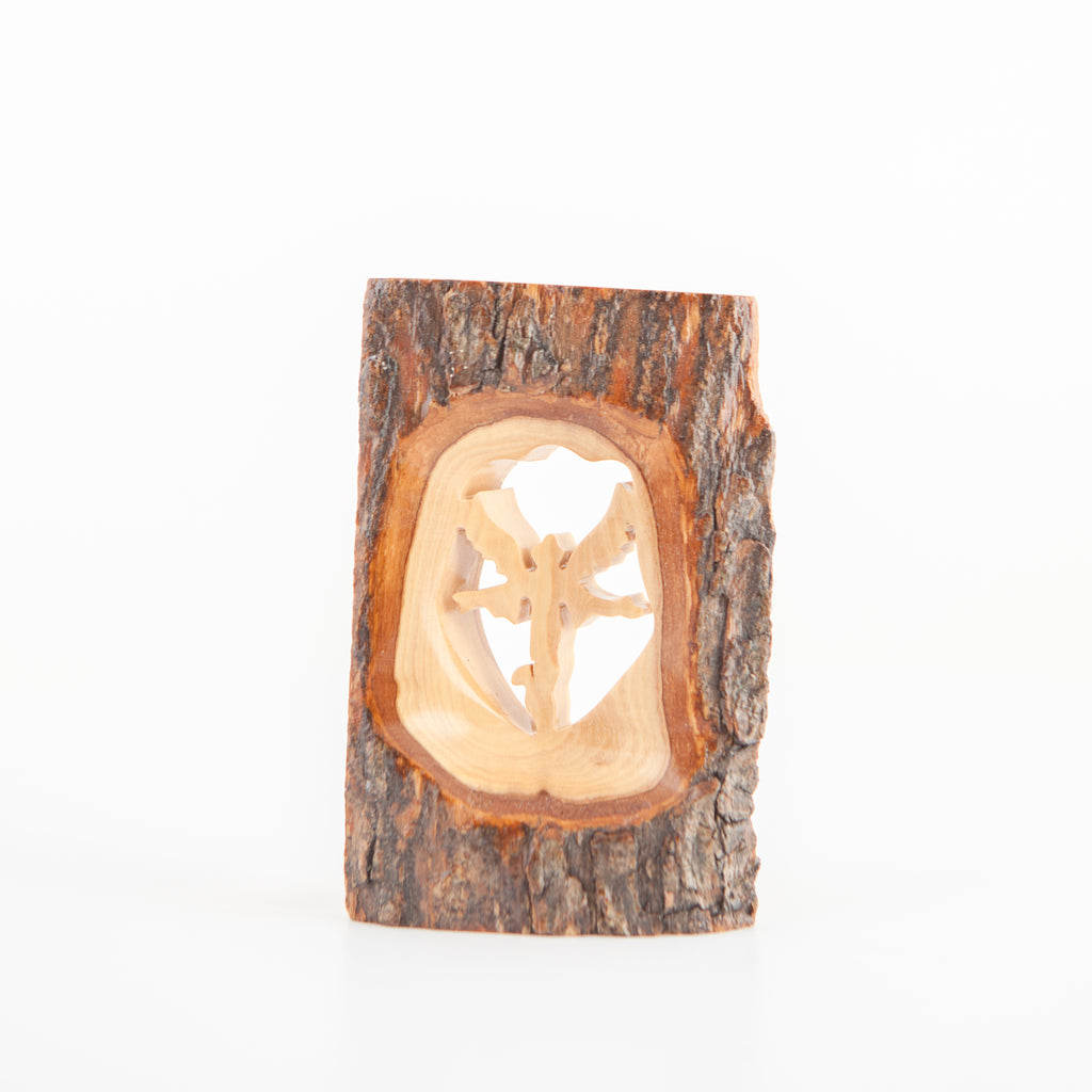 Olive wood Christmas ornament hand carved in Bethlehem, side angle of the olive wood sculpture
