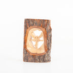 Olive wood Christmas ornament hand carved in Bethlehem, side angle of the olive wood sculpture