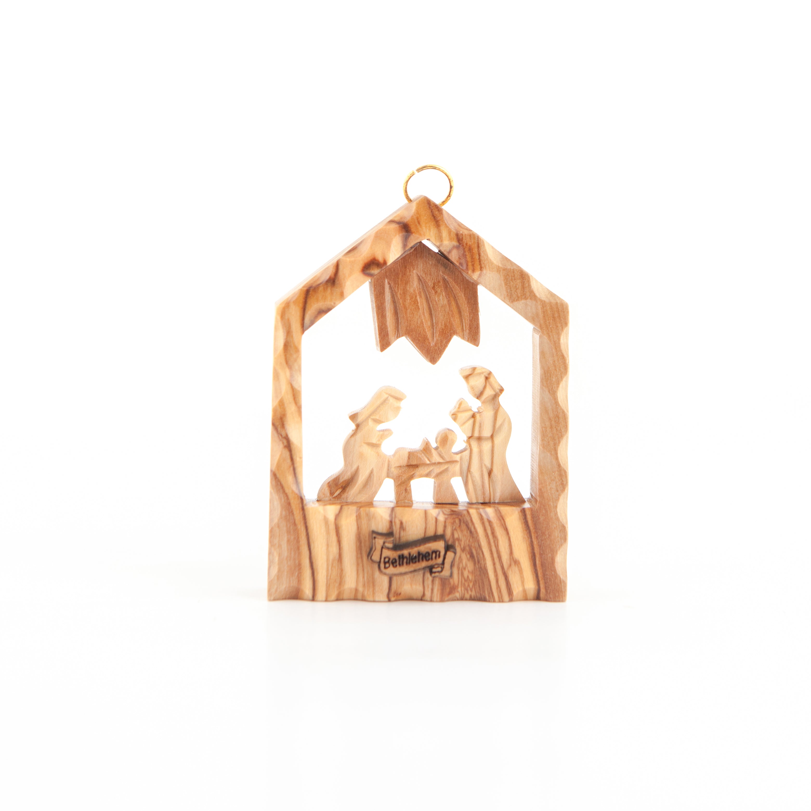 A hand-carved olive wood nativity scene ornament depicting the birthplace of Jesus Christ in Bethlehem.