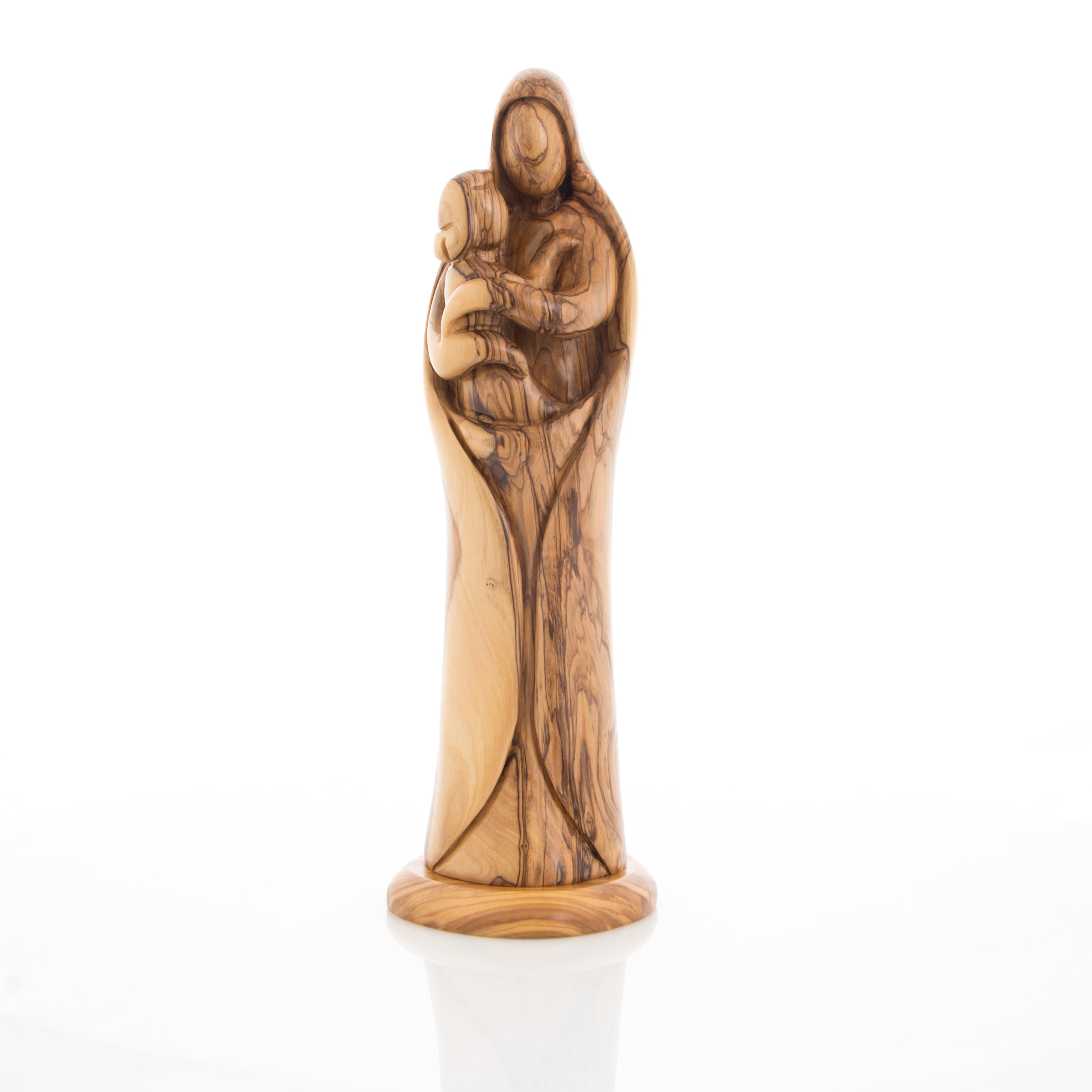 A wooden statue of the Virgin Mary holding the Holy Child, carved from olive wood with a natural finish.