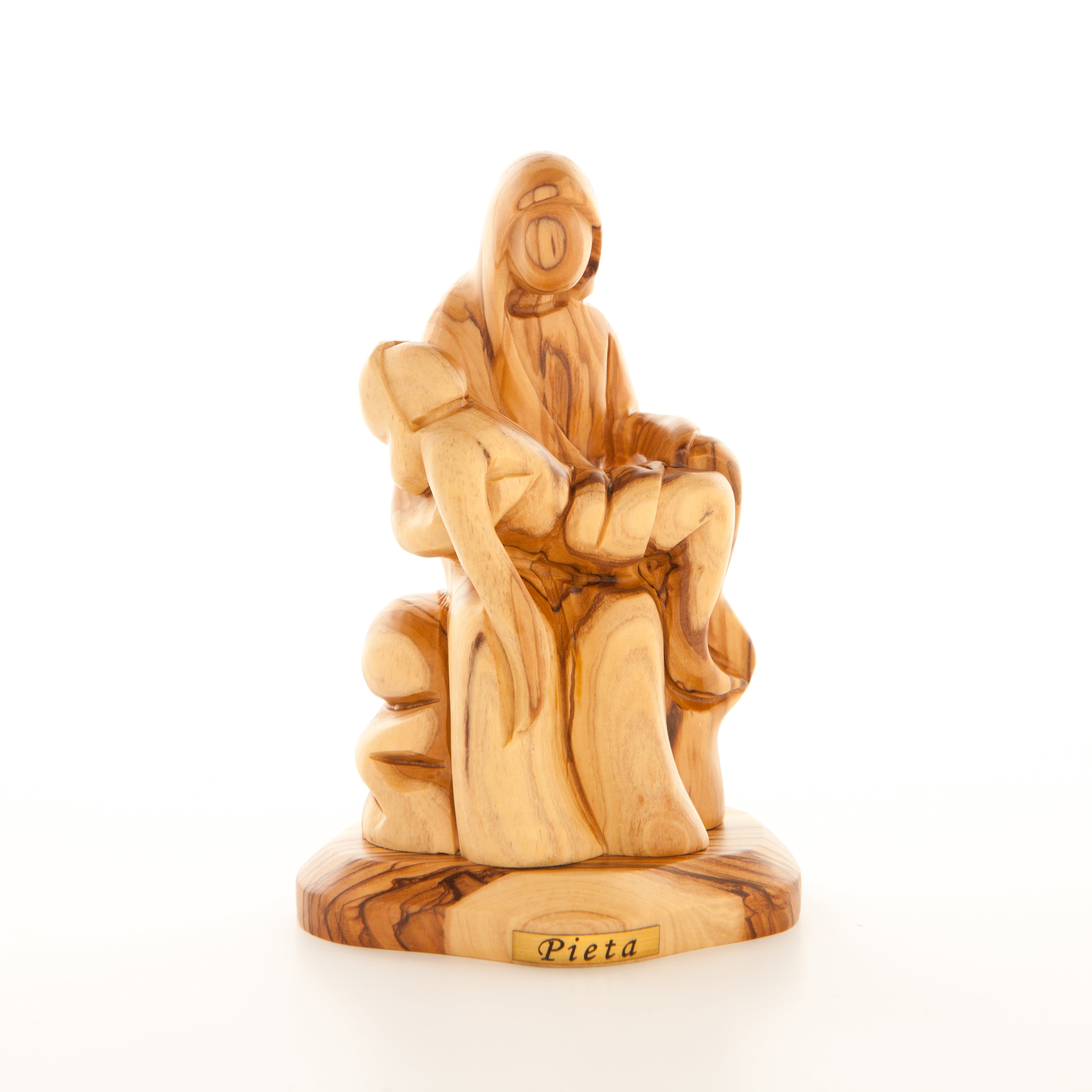 A wooden carving statue of the Pieta, depicting the Virgin Mary holding the lifeless body of Jesus.
