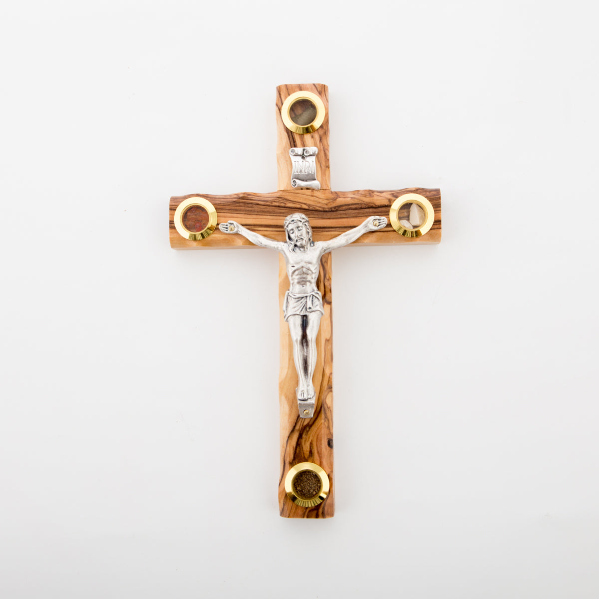 A wooden cross with four glass capsules containing holy incense, Bethlehem soil, Jerusalem stone, and dried olive leaves, against a white background.
