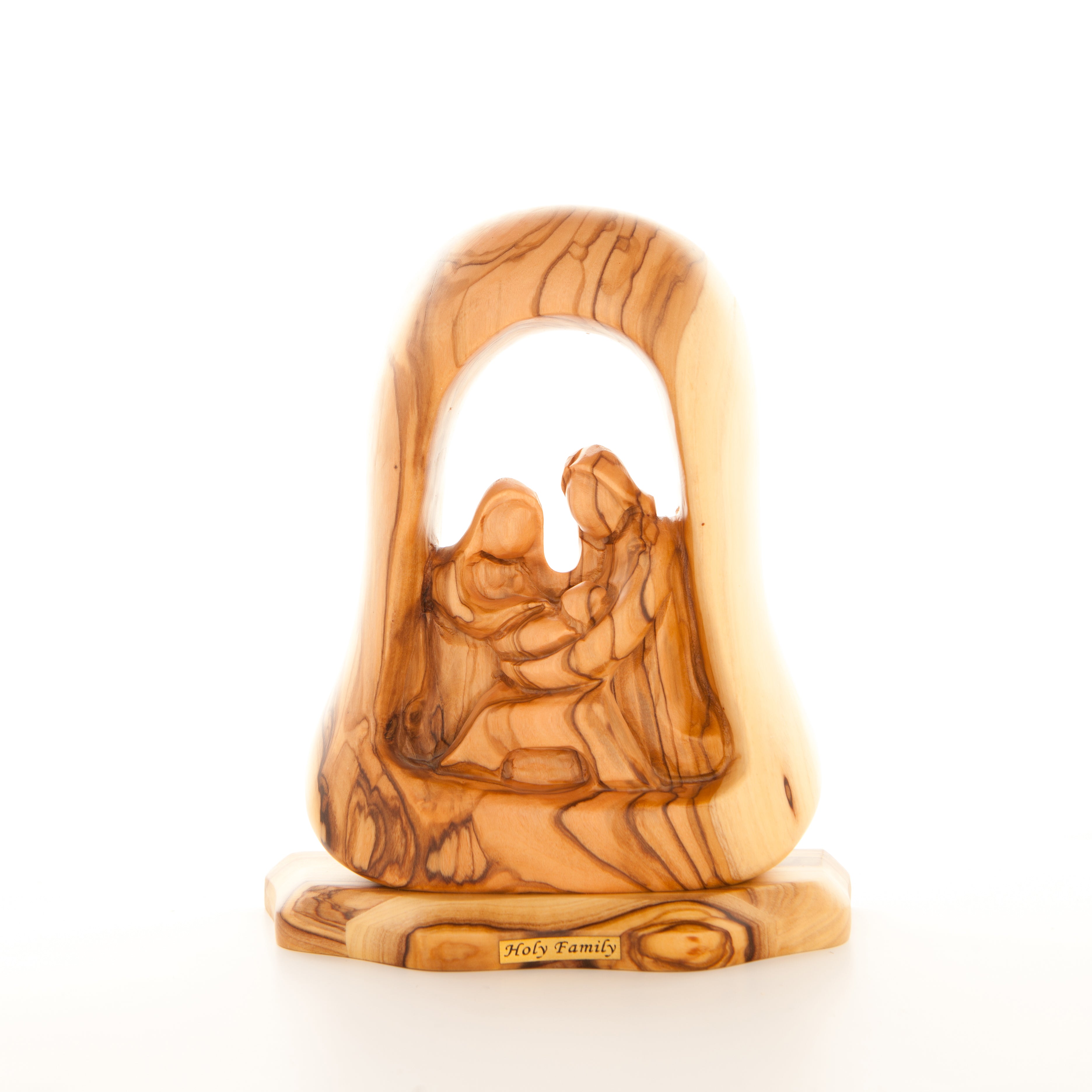 A wooden carved figurine depicting the nativity scene with the Holy Family in a manger.