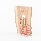 Olive wood Christmas ornament hand carved in Bethlehem, lifestyle photo on display
