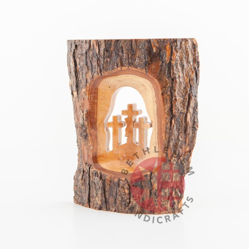 Olive wood Christmas ornament hand carved in Bethlehem, angle showing the olive wood color tones