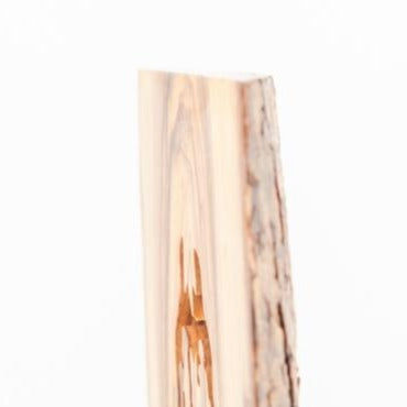 Olive wood Christmas ornament hand carved in Bethlehem, three quarter view of the religious piece