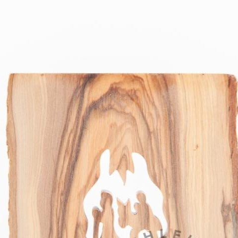 Olive wood Christmas ornament hand carved in Bethlehem, close detail of the hand carved work