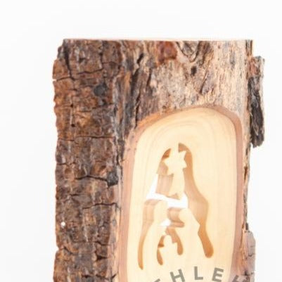 Olive wood Christmas ornament hand carved in Bethlehem, three quarter view of the religious piece