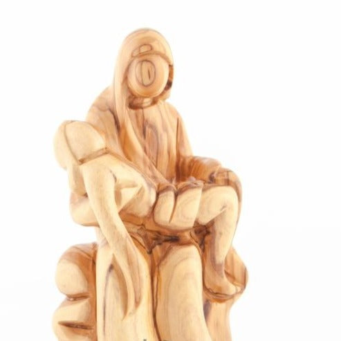 Pieta statue hand carved from Bethlehem olive wood, 6.3 inch three quarter view of the religious piece