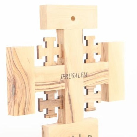 Olive wood wall cross hand carved in Bethlehem, three quarter view of the religious piece
