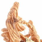Jesus Christ statue hand carved from Bethlehem olive wood, 10 inch three quarter view of the religious piece