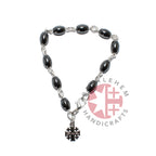 Olive wood rosary hand made in Bethlehem Holy Land, side angle of the olive wood sculpture