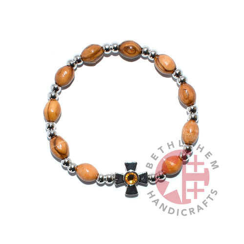 Olive wood rosary hand made in Bethlehem Holy Land, side angle of the olive wood sculpture