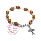 Olive wood crucifix hand carved in Bethlehem, three quarter view of the religious piece