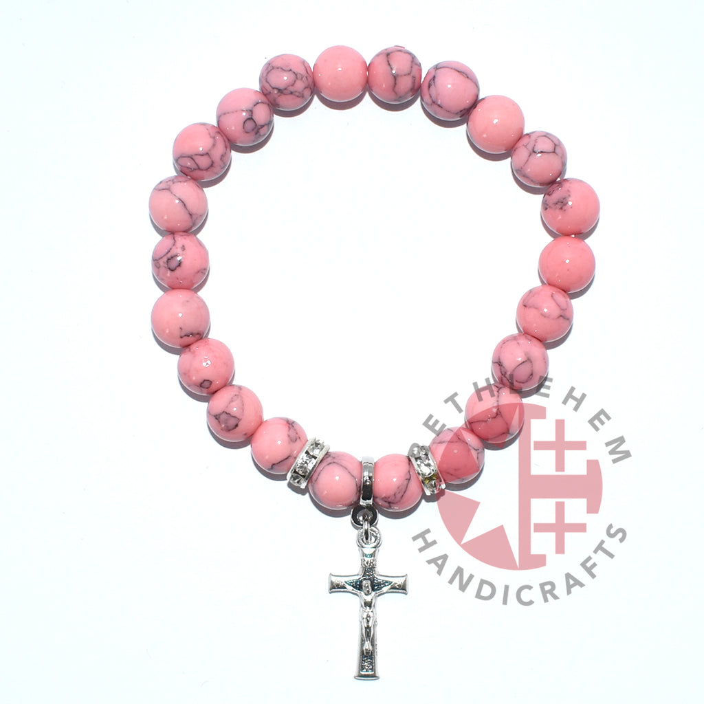 Olive wood rosary hand made in Bethlehem Holy Land, side angle of the olive wood sculpture