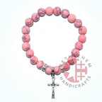 Olive wood rosary hand made in Bethlehem Holy Land, side angle of the olive wood sculpture