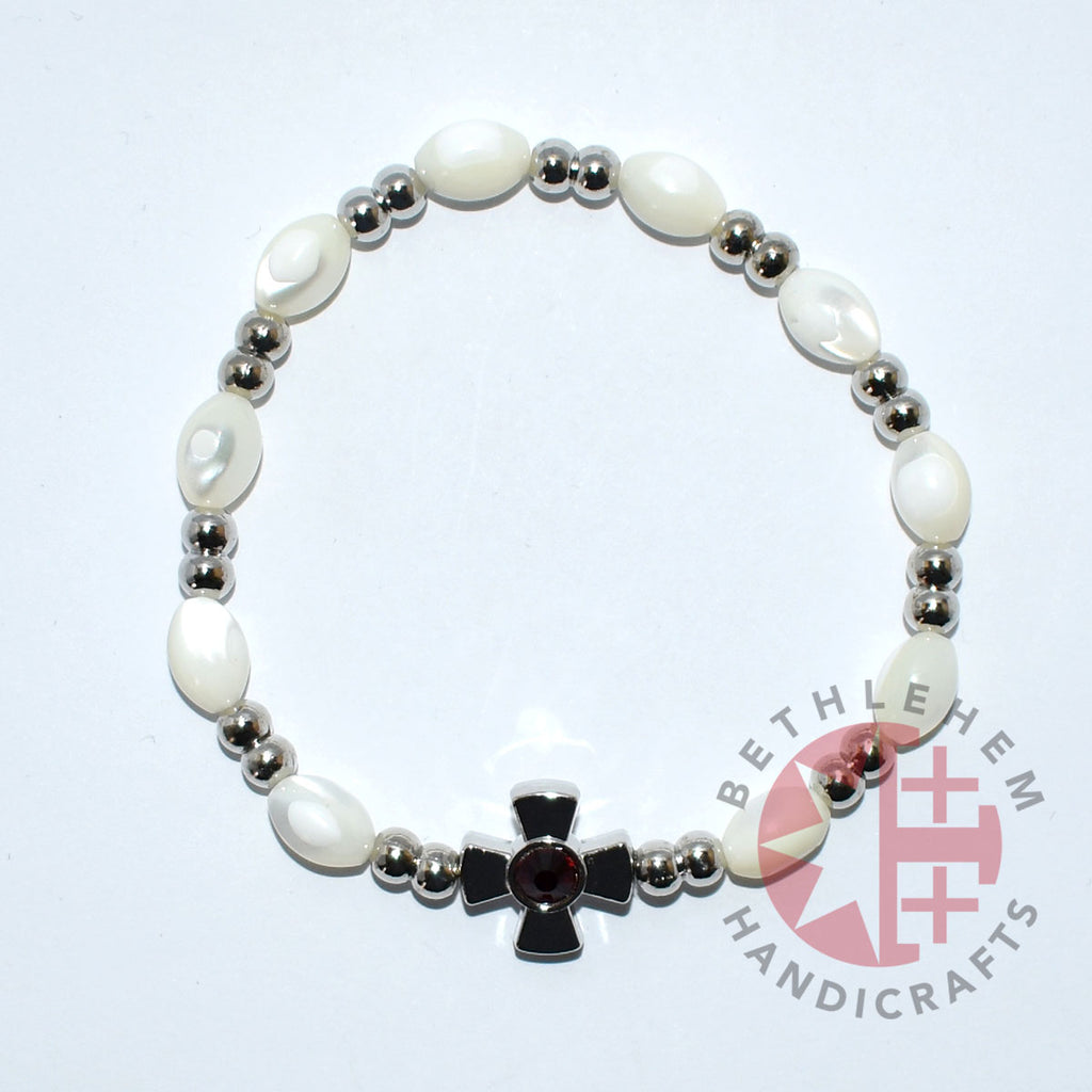 Olive wood rosary hand made in Bethlehem Holy Land, side angle of the olive wood sculpture