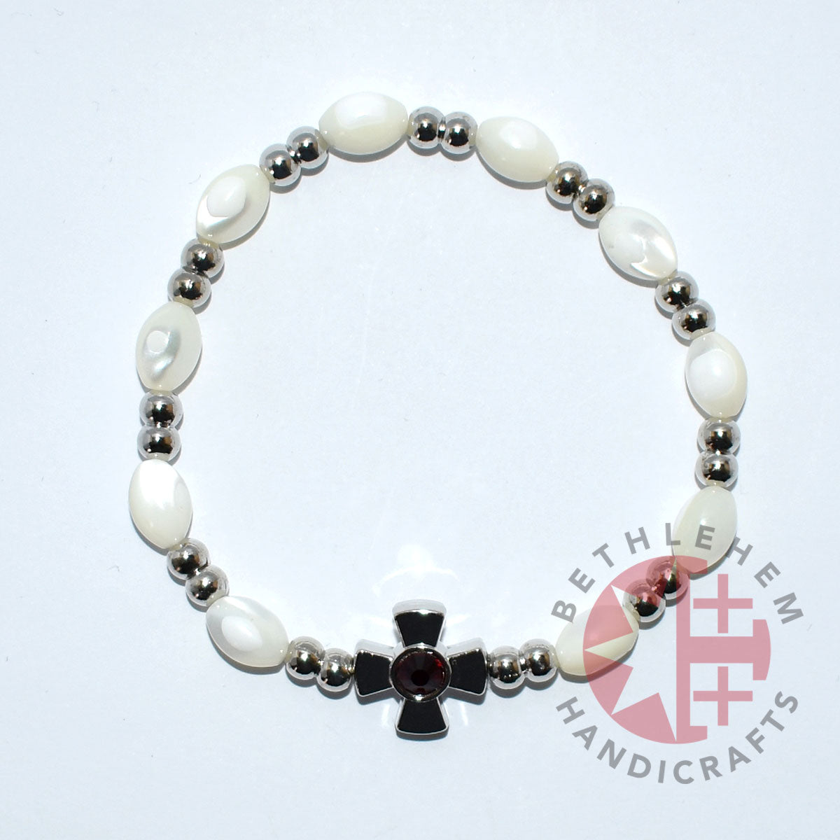 Olive wood rosary hand made in Bethlehem Holy Land, side angle of the olive wood sculpture